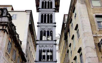 Santa Justa Lift between buildings in Lisbon Baixa, part of self-guided audio walking tour.