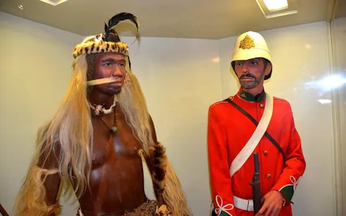 Zulu warrior and British soldier mannequins at Rorke’s Drift exhibit, Historic Zulu War Battlefields Tour.