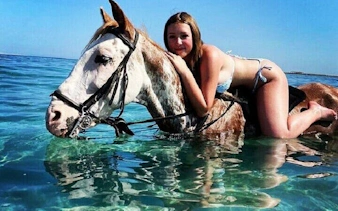 Swimming with a horse in the Red Sea near Hurghada.