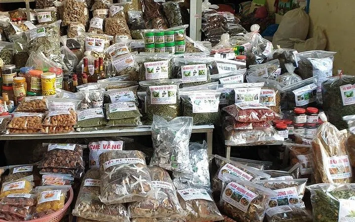 Market stall with various packaged spices and herbs in Sapa, Vietnam.