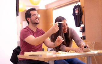 Participants crafting chopsticks at a workshop near Shinsaibashi and Dotonbori, Osaka.