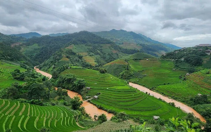 Terraced rice fields and winding river in Mu Cang Chai, Northern Vietnam.