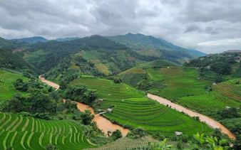 Terraced rice fields and winding river in Mu Cang Chai, Northern Vietnam.