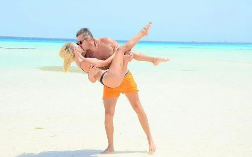 Couple enjoying beach at Ras Mohamed, Sharm el-Sheikh.