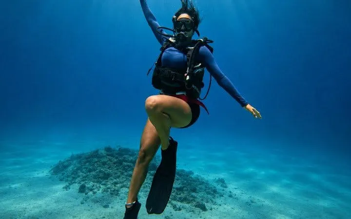 Snorkeler exploring coral reef at Tiran Island, Sharm El-Sheikh.