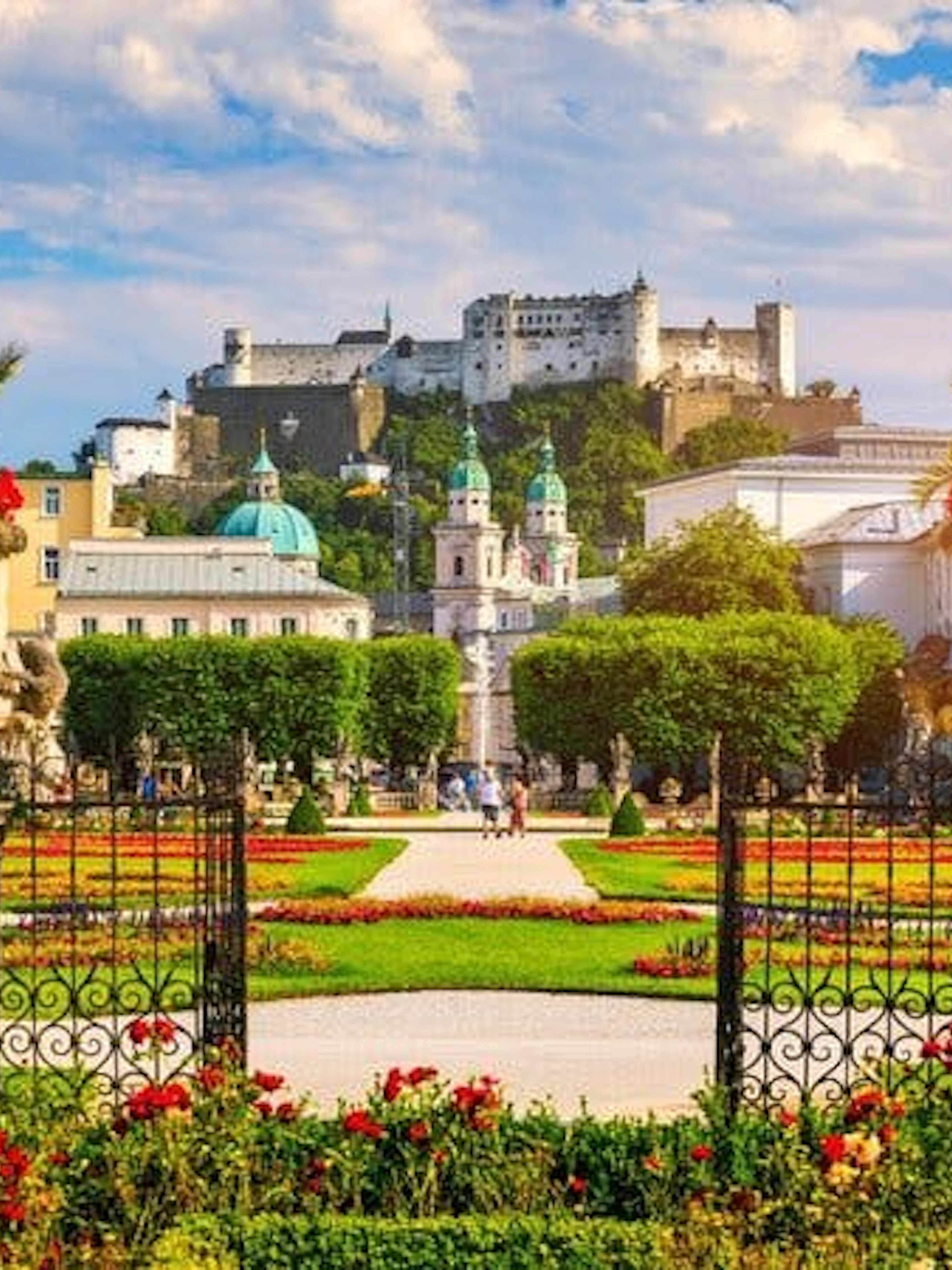 Mirabell Gardens with Hohensalzburg Fortress in Salzburg during a self-guided walking tour.