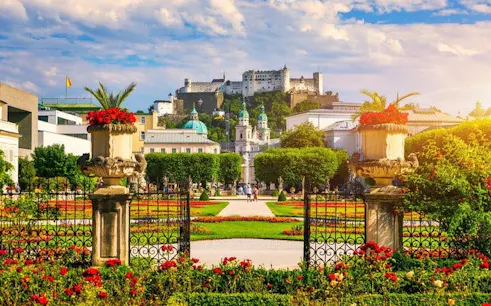 Mirabell Gardens with Hohensalzburg Fortress in Salzburg during a self-guided walking tour.