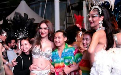 Guests posing with performers at Alcazar Cabaret Show, Pattaya.