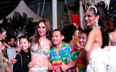 Guests posing with performers at Alcazar Cabaret Show, Pattaya.