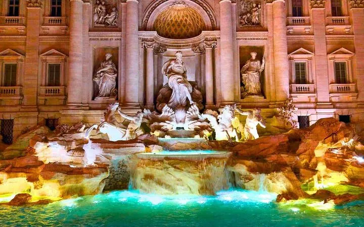 Trevi Fountain illuminated at night, featured in Rome self-guided walking tour app.