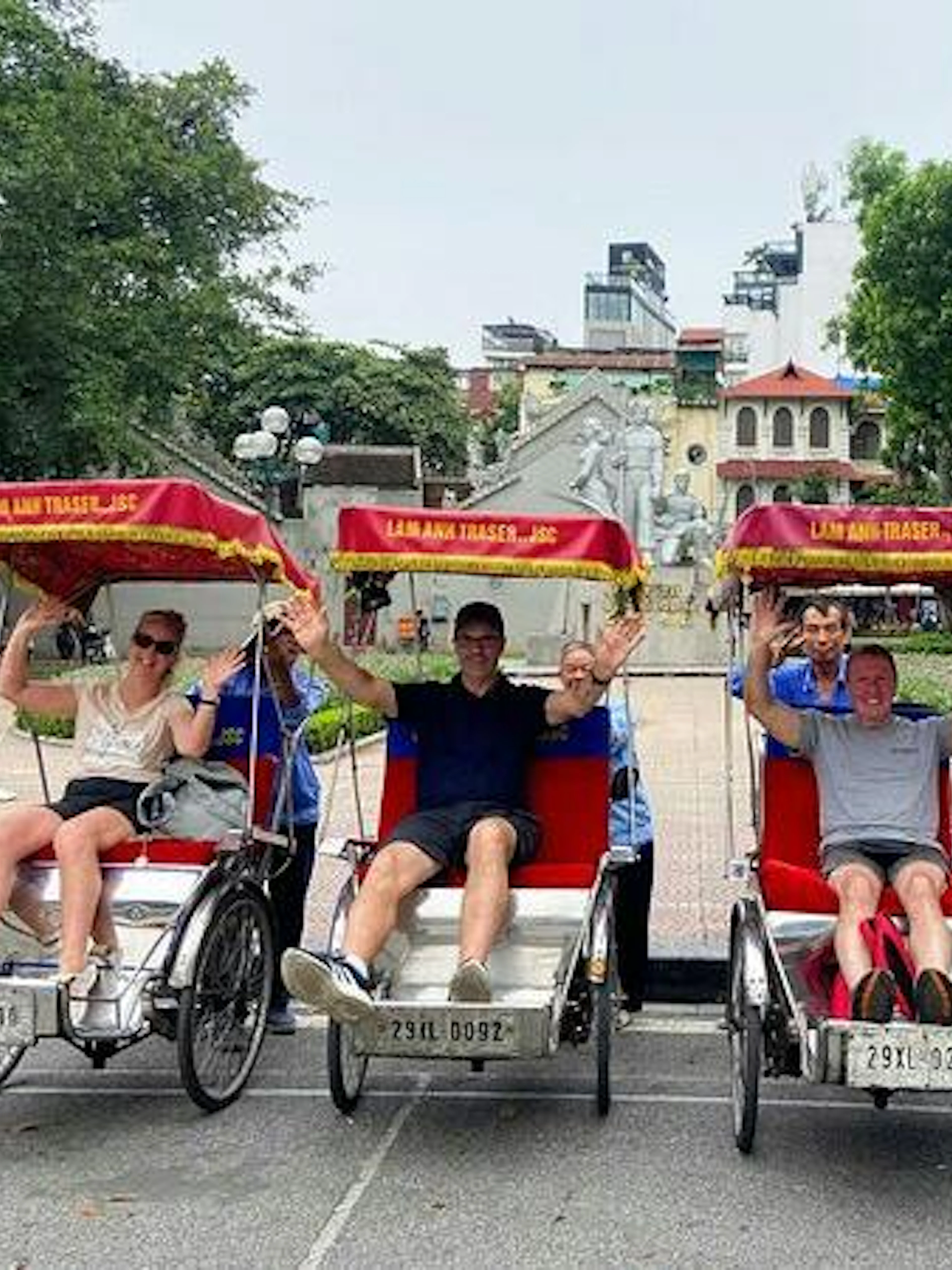 Tourists on cyclos in Hanoi's Old Quarter near Train Street.