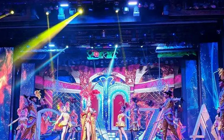 Alcazar Cabaret performers on stage in vibrant costumes, Pattaya.