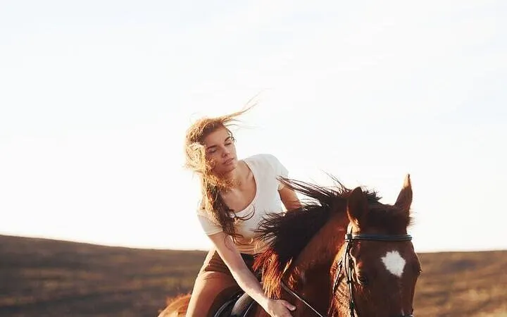 Horseback riding in the desert near Hurghada with a rider enjoying the experience.