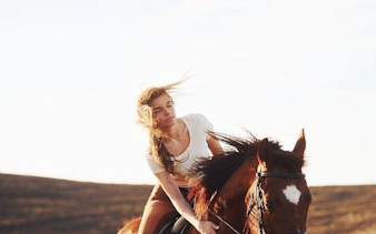 Horseback riding in the desert near Hurghada with a rider enjoying the experience.