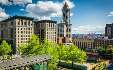 Seattle skyline featuring Smith Tower during Gold Rush city exploration game.