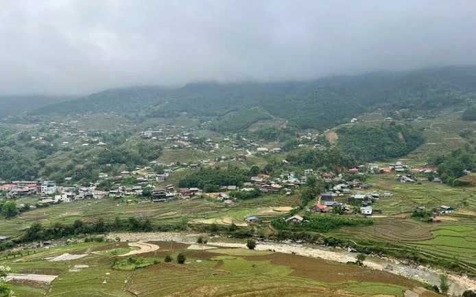 Sapa valley view with terraced fields and village, Vietnam.