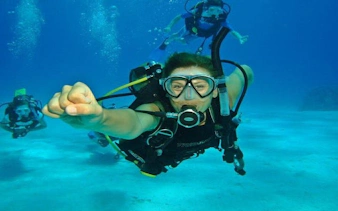 Scuba diver exploring underwater in Hurghada during a full-day boat trip.