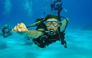 Scuba diver exploring underwater in Hurghada during a full-day boat trip.