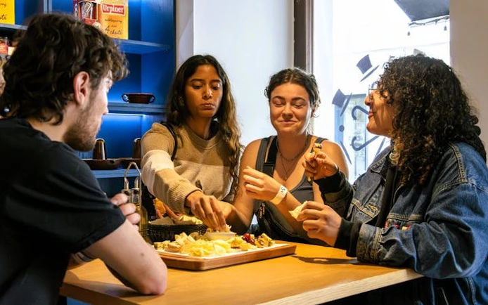 Group enjoying traditional Slovak food at a table in Bratislava.