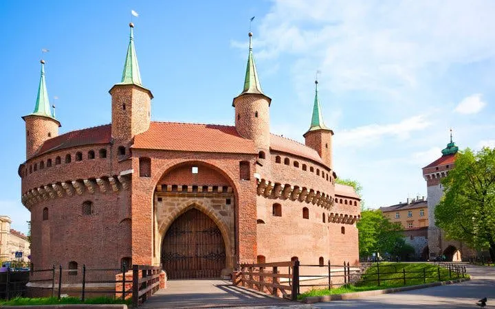 Krakow Barbican fortress on a sunny day, part of self-guided walking tour.