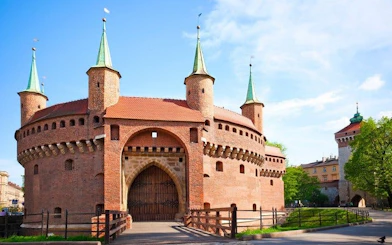 Krakow Barbican fortress on a sunny day, part of self-guided walking tour.