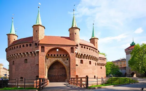 Krakow Barbican fortress on a sunny day, part of self-guided walking tour.