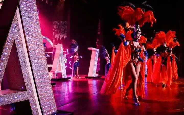 Performers in vibrant costumes at Alcazar Cabaret Show, Pattaya.
