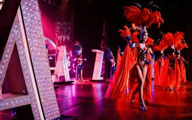 Performers in vibrant costumes at Alcazar Cabaret Show, Pattaya.