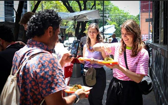 Group enjoying tacos on a street food tour in Mexico City.