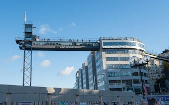 Gondolen viewing platform in Stockholm with people enjoying city views.
