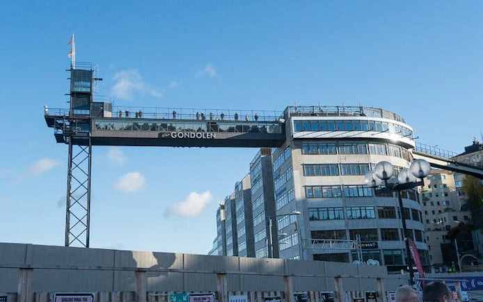 Gondolen viewing platform in Stockholm with people enjoying city views.