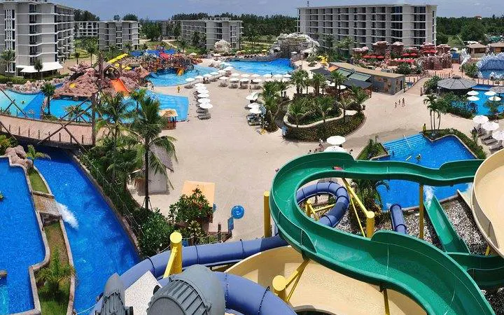 Splash Jungle Water Park in Phuket with slides, pools, and surrounding resort buildings.