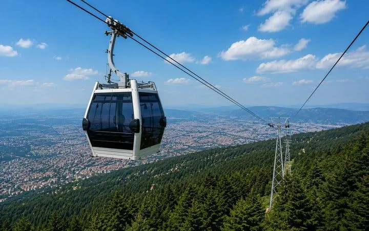 Cable car over Bursa with city and forest view.