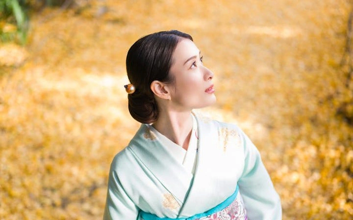 Silk kimono rental experience at Shinjuku Gyoen National Garden in autumn.