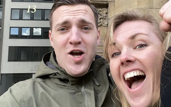 Couple enjoying Haunted Cologne self-guided city exploration game.