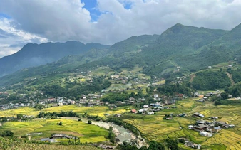 Sapa rice terraces and village with mountains in the background, Vietnam.