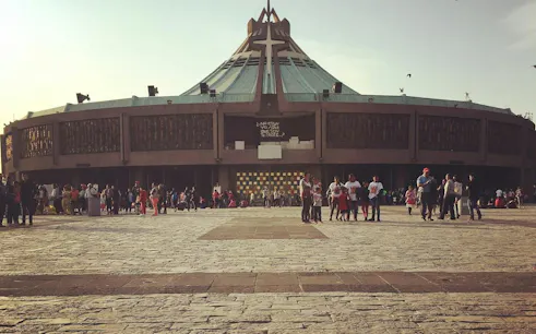 Crowd outside the modern Basilica of Guadalupe in Mexico City.