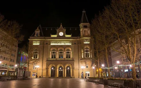 Luxembourg City Hall illuminated at night during a self-guided exploration game.