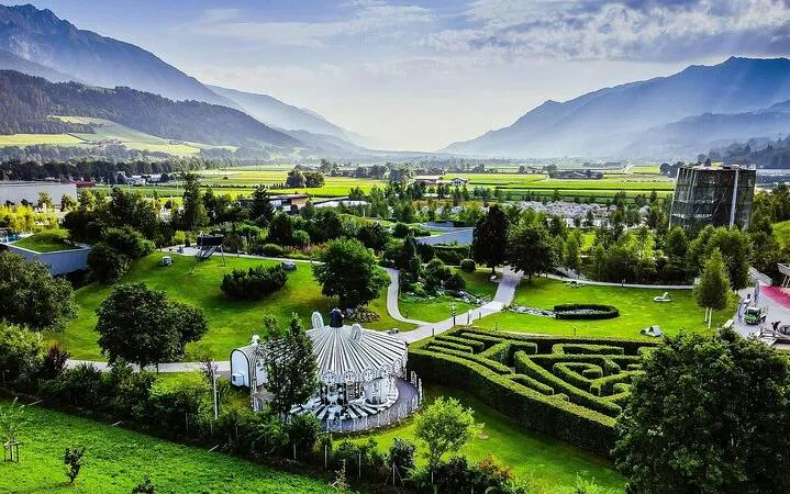 Aerial view of Swarovski Crystal Worlds garden with mountains in Innsbruck, Austria.
