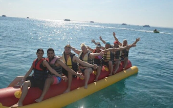 Group enjoying banana boat ride on the sea in Sharm El Sheikh.