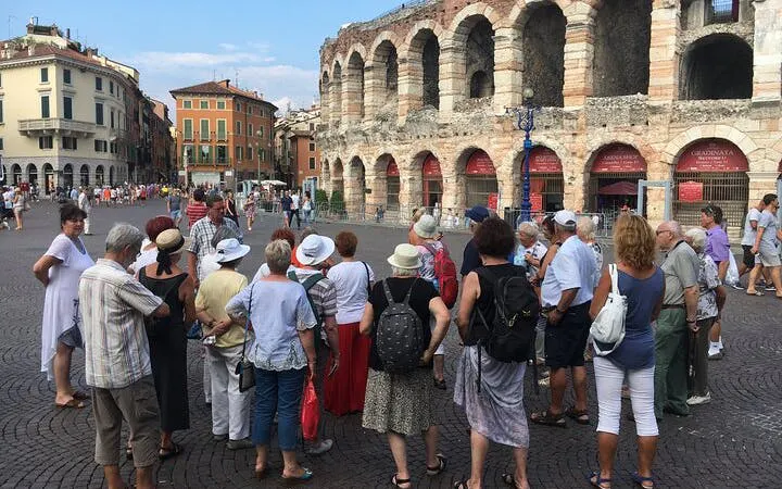 Tour group in front of Arena di Verona during a guided city tour.