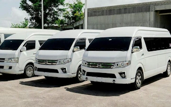 White tour vans for Santo Domingo guided tour with hotel transfers, Punta Cana.