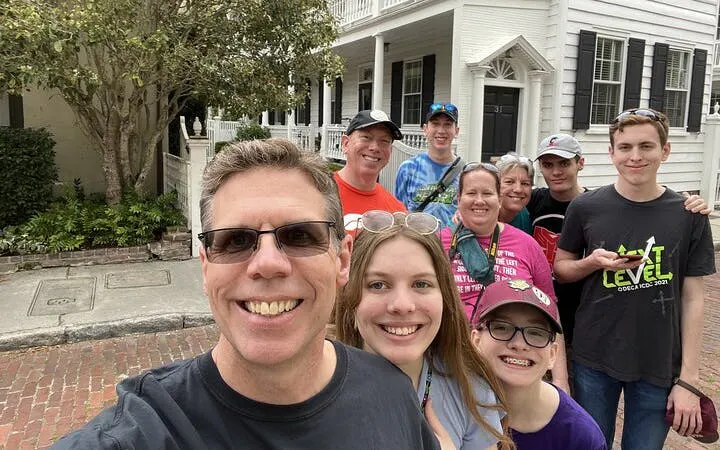 Group of tourists enjoying a self-guided exploration game in historic Charleston.