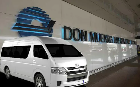 Shuttle van at Don Mueang Airport for transfer to Bangkok CBD hotels.