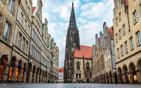 Münster Prinzipalmarkt with St. Lambert's Church on self-guided walking tour.