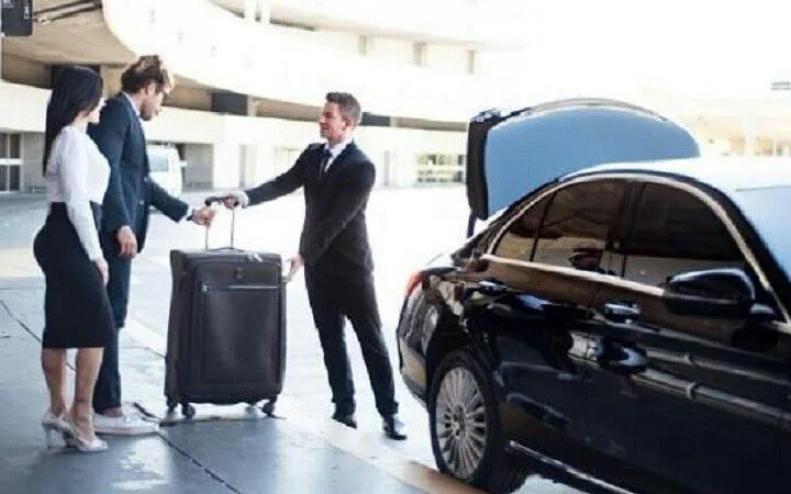 Private transfer service with luggage at Marrakech airport terminal.