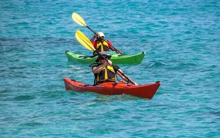 Kayakers paddling in clear waters during Key Largo Mangrove Kayak Adventure, Miami.