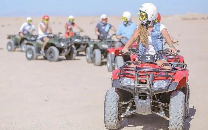 ATV riders exploring desert terrain near Blue Hole Canyon, Sharm El Sheikh.