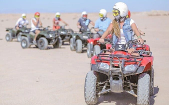 ATV riders exploring desert terrain near Blue Hole Canyon, Sharm El Sheikh.