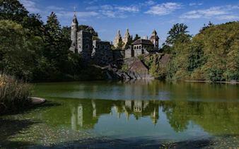 Belvedere Castle overlooking Turtle Pond in Central Park, New York, on a self-guided audio walking tour.